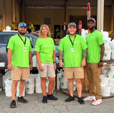 Annual Meeting Photo of Employees with Buckets