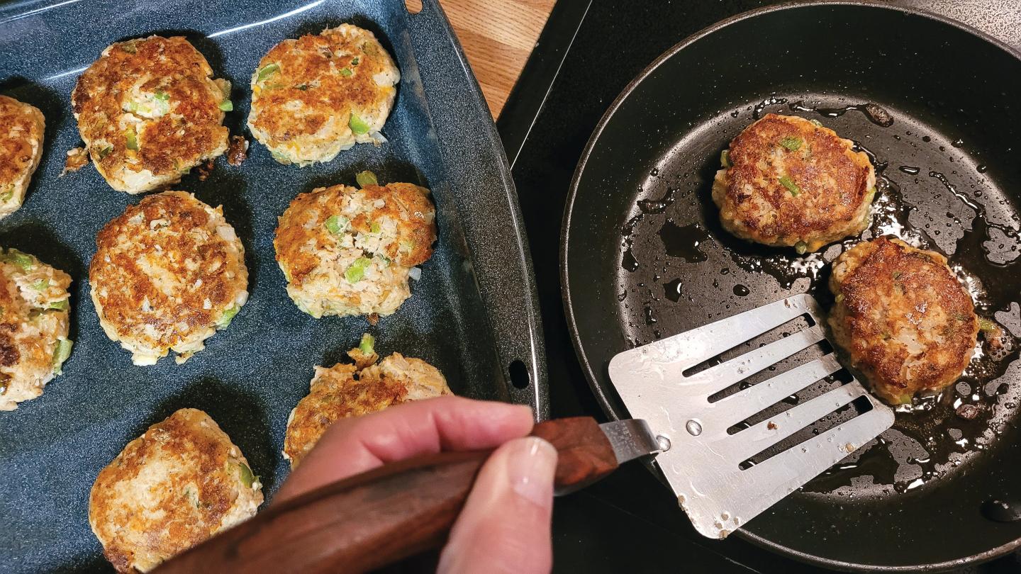 cooking-salmon-patties-on-top-of-stove